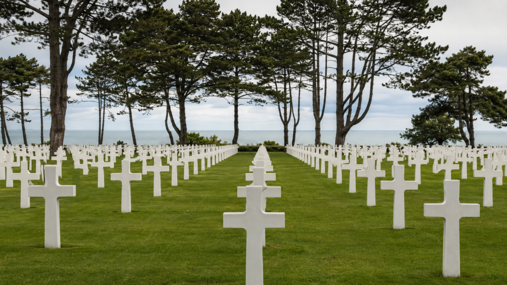 Rows of white marble headstones at the Normandy American Cemetery above Omaha Beach, a key stop on the Bayeux D-Day museum circuit.